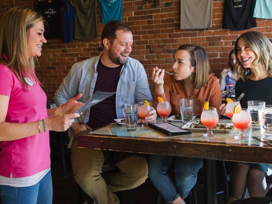 Two couples seated in a restaurant.